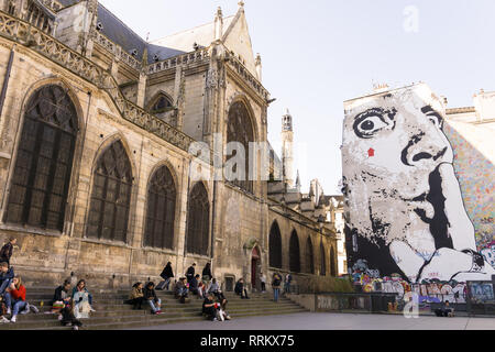 Saint Merry church and the autoportrait of the French artist Jef Aerosol overlooking Place Igor Stravinsky in Paris, France. Stock Photo