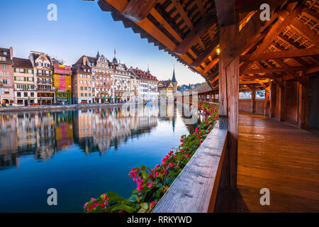 Kapellbrucke historic wooden bridge in Luzern and waterfront landmarks dawn view, town in central Switzerland Stock Photo