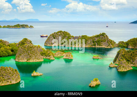Picturesque place - paradise lagoon with islands and turquoise calm water, Raja Ampat, Papua, Indonesia. Stock Photo
