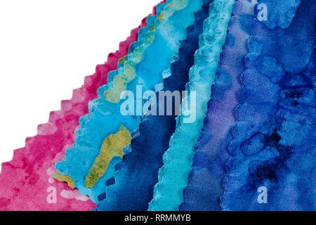 Multi-colored remnants of fabric  isolated on white Stock Photo