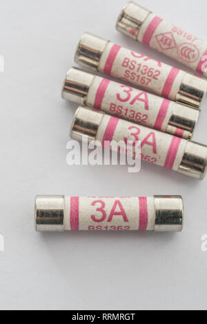 3 Amp household ceramic cartridge fuses. Stock Photo