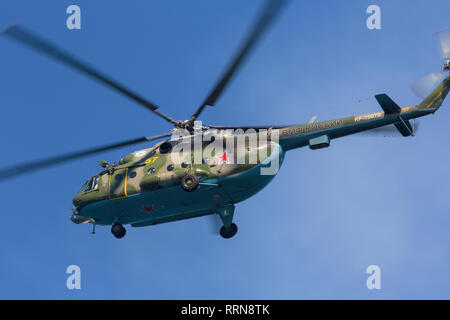 Russian military multi-purpose helicopter of the Russian Navy Miles Mi-8MT flying high in the sky Stock Photo