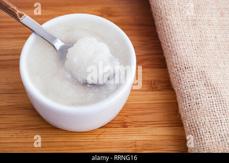Coconut oil in a bowl. Close up. Stock Photo