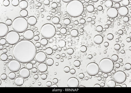 Surface with colorless bubbles in the liquid. Abstract background. Stock Photo