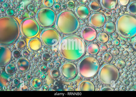 Surface with colored bubbles in the liquid. Abstract background. Stock Photo