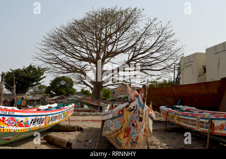 Old baobab tree and pirogues in Joal-Fadiouth, Senegal Stock Photo
