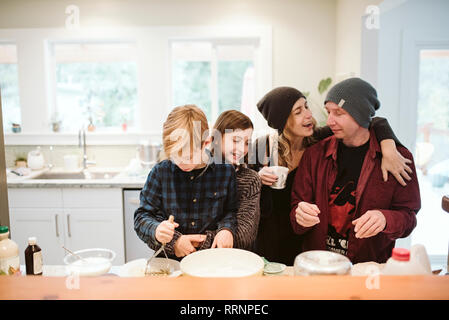 Affectionate family baking in kitchen Stock Photo