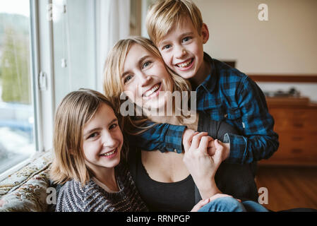 Portrait happy, affectionate mother and children Stock Photo