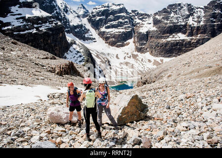 Women hiking in sunny, craggy mountain landscape, Yoho Park, British Columbia, Canada Stock Photo