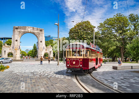 3 January 2019: Christchurch, New Zealand - A vintage tram turns into Cashel Street near the Bridge of Remembrance in the centre of Christchurch. Stock Photo