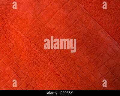 Trend photography on the theme of the actual colors for this season - a shade of orange. Beautiful coral color leather background Stock Photo