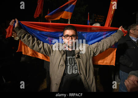 Buenos Aires, Argentina - Apr 25, 2016: Demonstrator holding the flag of Armenia during a march for the recognition of the Armenian Genocide in the Ot Stock Photo