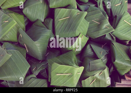 Thai dessert egg custard with sticky rice on banana leaf Stock Photo