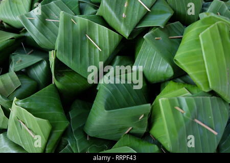 Thai dessert egg custard with sticky rice on banana leaf Stock Photo