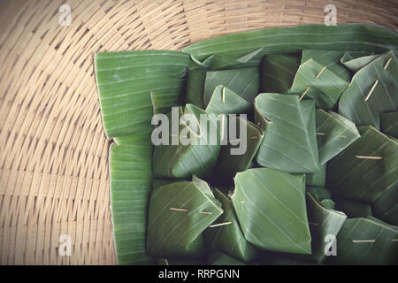 Thai dessert egg custard with sticky rice on banana leaf Stock Photo