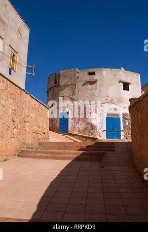 New stairs up the hill to the houses, where is located the traditional ceramics production. Brigh blue sky, matching with the color of the gates. Safi Stock Photo