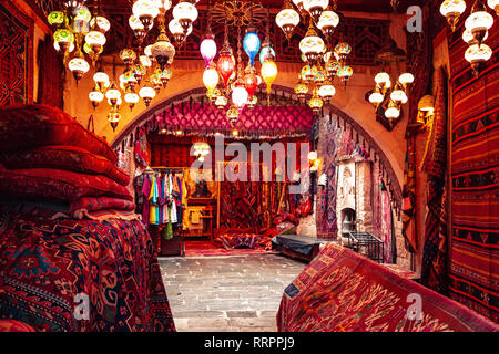 Traditional Turkish handmade carpets in the gift shop. Goreme, Cappadocia, Turkey. Stock Photo