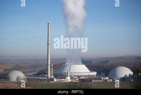 Neckarwestheim, Germany. 26th Feb, 2019. Steam comes from the cooling tower (M) of unit 2 of the Neckarwestheim nuclear power plant, next to it are units 1 (l) and 2 (r) of the nuclear power plant. Based on a fictitious severe accident at the Neckarwestheim nuclear power plant, federal and state authorities are practicing radiological disaster control. Credit: Marijan Murat/dpa/Alamy Live News Stock Photo
