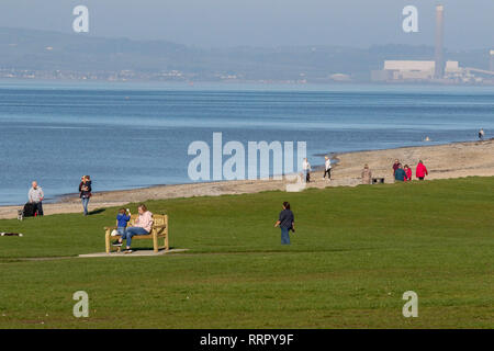 Holywood, County Down, Northern Ireland. 26 February 2019. UK weather - glorious sunshine on the coast of Belfast Lough at Holywood. Plenty of people about taking in the exceptional late winter weather with temperatures around 16 C. Credit: David Hunter/Alamy Live News. Stock Photo