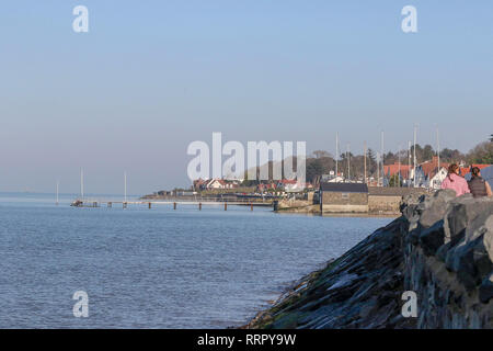 Holywood, County Down, Northern Ireland. 26 February 2019. UK weather - glorious sunshine on the coast of Belfast Lough at Holywood. Plenty of people about taking in the exceptional late winter weather with temperatures around 16 C. Credit: David Hunter/Alamy Live News. Stock Photo