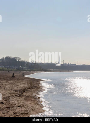 Holywood, County Down, Northern Ireland. 26 February 2019. UK weather - glorious sunshine on the coast of Belfast Lough at Holywood. Plenty of people about taking in the exceptional late winter weather with temperatures around 16 C. Credit: David Hunter/Alamy Live News. Stock Photo