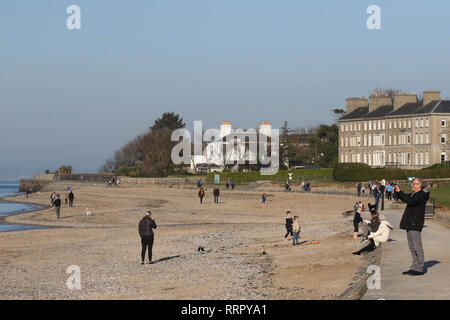 Holywood, County Down, Northern Ireland. 26 February 2019. UK weather - glorious sunshine on the coast of Belfast Lough at Holywood. Plenty of people about taking in the exceptional late winter weather with temperatures around 16 C. Credit: David Hunter/Alamy Live News. Stock Photo