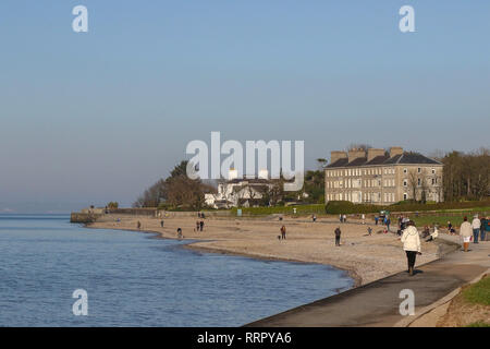 Holywood, County Down, Northern Ireland. 26 February 2019. UK weather - glorious sunshine on the coast of Belfast Lough at Holywood. Plenty of people about taking in the exceptional late winter weather with temperatures around 16 C. Credit: David Hunter/Alamy Live News. Stock Photo