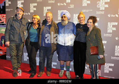 Glasgow, UK. 26th Feb, 2019. (left - right) Charlie Paul - Director; wife of Peter Howson; Peter Howson - Artist; Hardeep Singh Kohli - Presenter; unknown, seen on the red carpet at the Premier of the film, Prophecy, at the Glasgow Film Theater. Credit: Colin Fisher/Alamy Live News Stock Photo