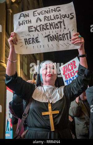 Protesters from Class War anarchist group hold a lively demonstration outside the London Palladium theatre against the evening talk featuring Jacob Rees-Mogg, Conservative MP and prominent Brexit supporter. Class War members, including long-time anarchist, Ian Bone, Jane Nicholl (pictured dressed as a nun) and Adam Clifford (as Rees-Mogg parody) claim Mr Rees-Mogg, a Catholic, is a religious extremist because of his outspoken views on abortion. Stock Photo