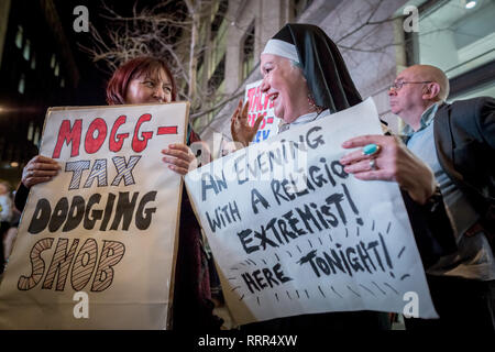 Protesters from Class War anarchist group hold a lively demonstration outside the London Palladium theatre against the evening talk featuring Jacob Rees-Mogg, Conservative MP and prominent Brexit supporter. Class War members, including long-time anarchist, Ian Bone (with megaphone), Jane Nicholl (pictured dressed as a nun) and Adam Clifford (as Rees-Mogg parody) claim Mr Rees-Mogg, a Catholic, is a religious extremist because of his outspoken views on abortion. Stock Photo