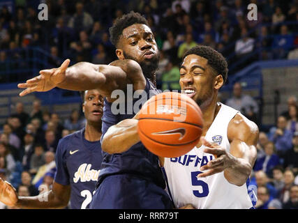Amherst, New York, USA. 26th Feb 2019. Buffalo Bulls guard CJ Massinburg (5) passes the ball past Akron Zips forward Daniel Utomi (3) during the first half of play in the NCAA Basketball game between the Akron Zips and Buffalo Bulls at Alumni Arena in Amherst, N.Y. (Nicholas T. LoVerde/Cal Sport Media) Credit: Cal Sport Media/Alamy Live News Stock Photo