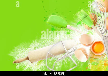 Baking utensils and cooking ingredients for muffins, cookies, dough and pastry. Flat lay with eggs, flour and sugar. Top view Stock Photo