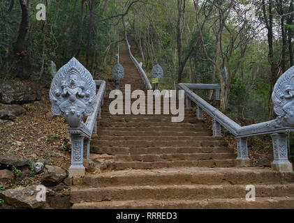 The spectacular staircase of 358 steps up Phnom Banan with Nagas (sacred serpents) protecting the way to Prasat Banan. Battambang, Cambodia 15-12-2018 Stock Photo