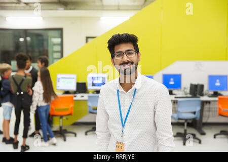 Portrait confident junior high teacher in library Stock Photo