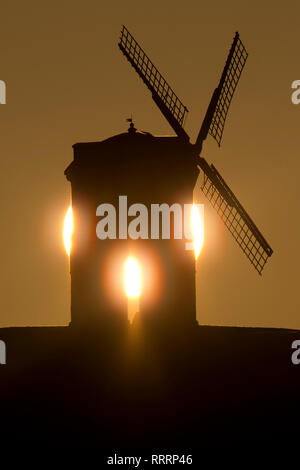 The Sun rises behind Chesterton Windmill in Warwickshire on 26 February 2019. Stock Photo