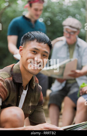 Portrait confident man with map, preparing for hike Stock Photo