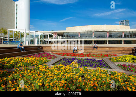 Colourful flower garden at HaBima square, Tel Aviv. In the background, Charles Bronfman Auditorium Stock Photo