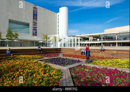 Colourful flower garden at HaBima square, Tel Aviv. In the background, Habima national theatre (left) and Charles Bronfman Auditorium (right) Stock Photo