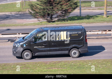 Addison Lee couriers delivery van driving on the road. Mail courier transport business Stock Photo