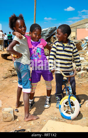 Johannesburg, South Africa - October 04 2011: African Children in a Tornado damaged Township Stock Photo