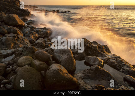 South Pacific, USA, Hawaii, Hawaiian, Island, Big Island, rocky beach at sunset Stock Photo