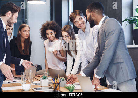 Business professionals. Group of colleagues analyzing data using computers Stock Photo