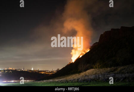 Scene of a gorse fire below Salisbury Crags in Holyrood Park, Edinburgh. Stock Photo