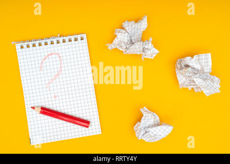 Pencil, notebook and crumpled sheets of paper. Stock Photo