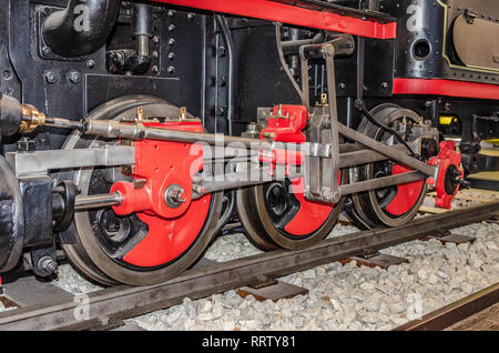 The wheels of the old locomotive. Stock Photo