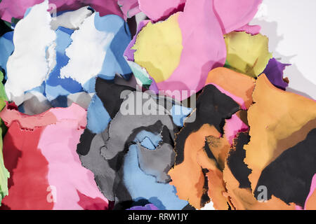 Red background with fingerprints made from plasticine. Stock Photo