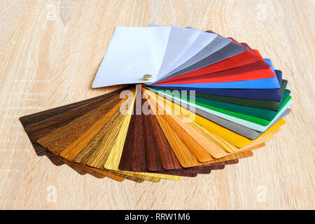 Lamination samples. On a wooden background for lamination of any wooden and plastic products used in construction Stock Photo