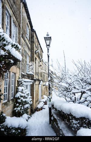 Picturesque christmas card scene of weavers cottages in the snow Stock Photo