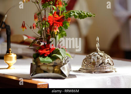 close up of red service bell with ring for a kiss lettering isolated on  grey Stock Photo - Alamy