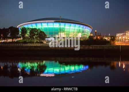 Glasgow/Scotland - September 20 2016: The SSE Hydro lit up in blue and green and reflected in the Clyde River at night Stock Photo